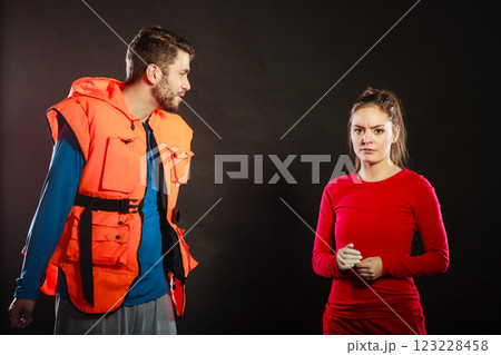 Angry man lifeguard shouting at woman lifesaver. Angry man lifeguard shouting at woman lifesaver. 123228458