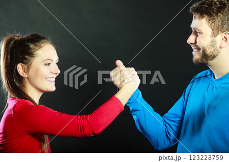 Friends man and woman clasping shaking hands. Friends man and woman clasping shaking hands. 123228759