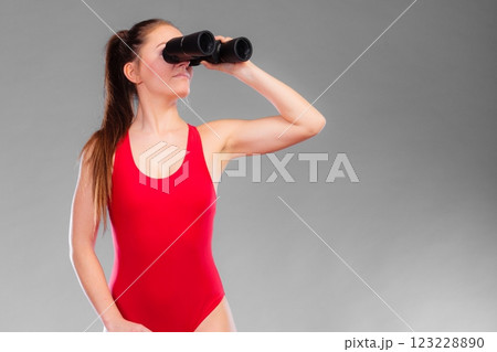 lifeguard on duty looking through binocular 123228890