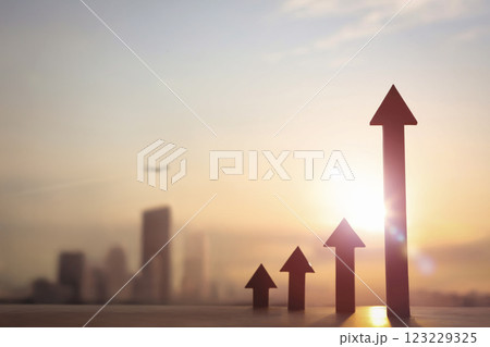 Soaring arrow symbolizing business success and growth with financial city background, stock and economic industry and real estate investment concept 123229325