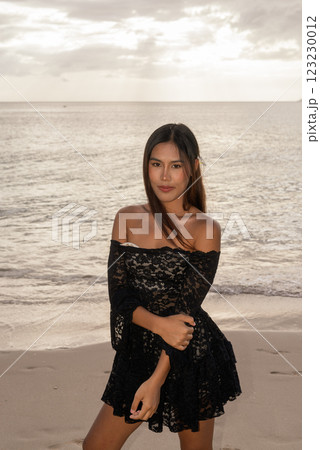 Beautiful young Asian woman during summer beach holiday 123230012