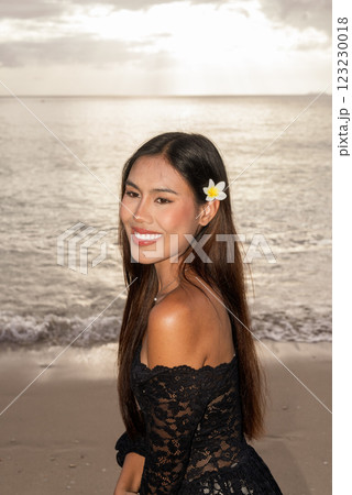 Beautiful young Asian woman during summer beach holiday 123230018