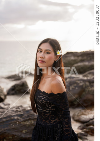 Beautiful young Asian woman during summer beach holiday 123230037