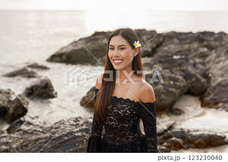 Beautiful young Asian woman during summer beach holiday 123230040