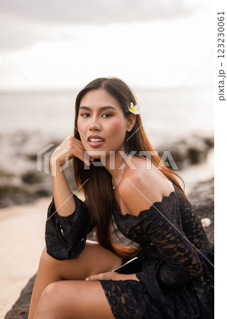 Beautiful young Asian woman during summer beach holiday Beautiful young Asian woman during summer beach holiday 123230061