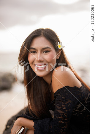Beautiful young Asian woman during summer beach holiday 123230065