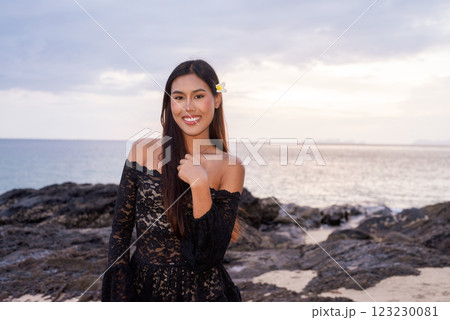 Beautiful young Asian woman during summer beach holiday 123230081