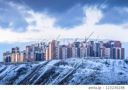 New buildings, a new residential neighborhood under construction houses for sale in Krasnoyarsk, Russia, Exploring Urban Development Within a Beautiful Winter Landscape Featuring Cranes 123230286