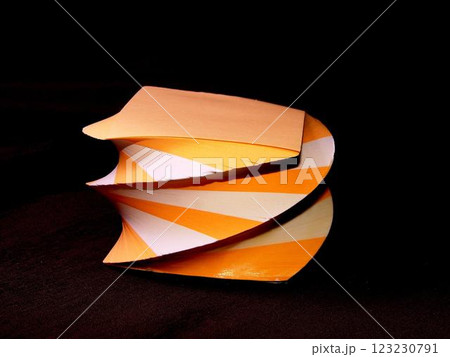 Orange and white papers for notes organized in a form of decorative towers Orange and white papers for notes organized in a form of decorative towers 123230791