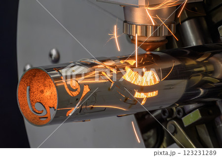 Close up scene the fiber laser cutting machine cut the stainless steel tube and sparkling light. 123231289