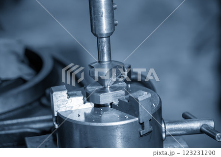 The hole chamfering process on NC milling machine by chamfer tool in the light blue scene. 123231290