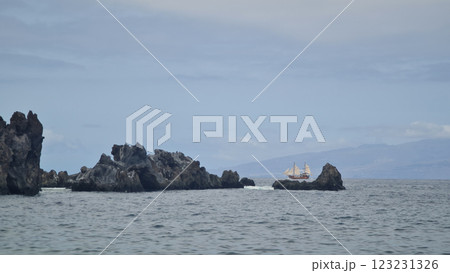 Black rocks in the ocean. 123231326