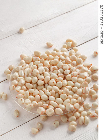 Dried fruits in white milk chocolate. Candies on a wooden background. 123231370