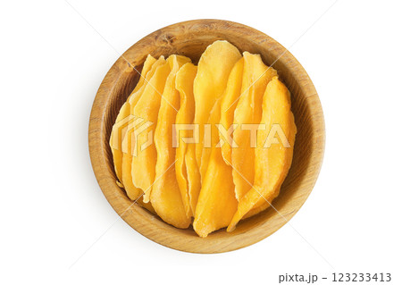 dried mango in wooden bowl isolated on white background. Top view. Flat lay 123233413