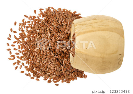 flaxseed in wooden bowl isolated on white background. Top view. Flat lay 123233458