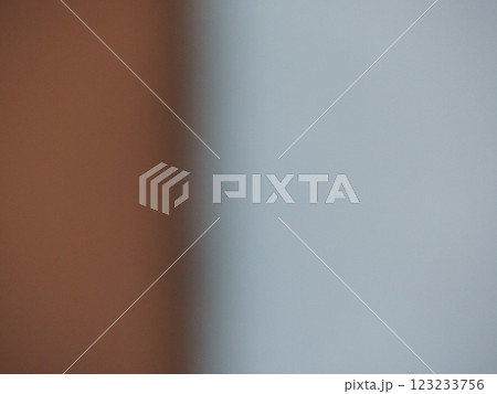 blurred two-tone background with contrasting uneven parts of gray and brown shades with empty copy space, defocused graphic minimalist backdrop 123233756