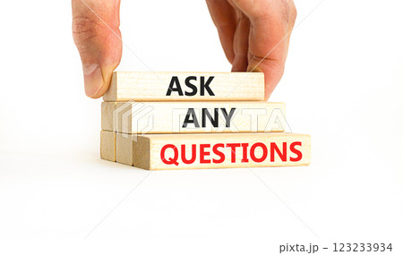 Ask any questions symbol. Concept words Ask any questions on beautiful wooden blocks. Beautiful white table white background. Businessman hand. Business ask any questions concept. Copy space. 123233934