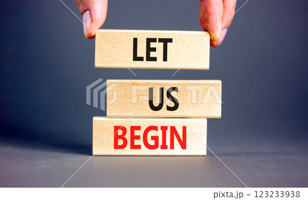 Let us begin symbol. Concept words Let us begin on beautiful wooden blocks. Beautiful grey background. Businessman hand. Business motivational let us begin concept. Copy space. Let us begin symbol. Concept words Let us begin on beautiful wooden blocks. Beautiful grey background. Businessman hand. Business motivational let us begin concept. Copy space. 123233938