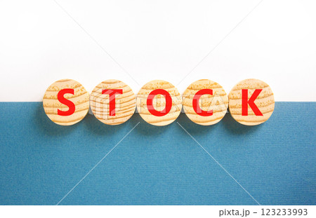 Stock symbol. Concept word Stock on beautiful wooden circles. Beautiful white and blue background. Business lifestyle stock concept. Copy space. 123233993