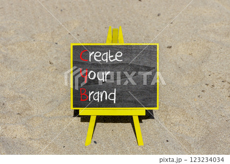 CYB Create your brand symbol. Concept words CYB Create your brand on beautiful yellow blackboard. Beautiful sand background. Business CYB Create your brand concept. Copy space. 123234034