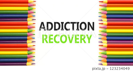 Addiction recovery symbol. Concept words Addiction recovery on beautiful white paper. Colored pencils. Beautiful white paper background. Psychology addiction recovery concept. Copy space. Addiction recovery symbol. Concept words Addiction recovery on beautiful white paper. Colored pencils. Beautiful white paper background. Psychology addiction recovery concept. Copy space. 123234049