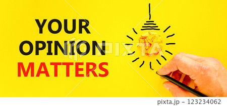 Your opinion matters symbol. Concept words Your opinion matters on beautiful yellow paper. Beautiful yellow background. Businessman hand. Light bulb. Business your opinion matters concept. Copy space. 123234062