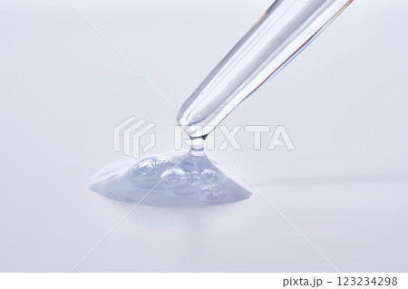 Pipette with delicate blue serum close-up. 123234298