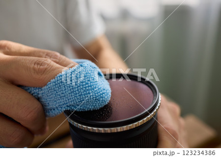 Successfully Cleaning Your Camera Lens with a High-quality Microfiber Cloth to Ensure Clarity 123234386