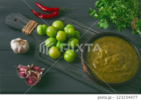 Tkemali sauce, traditional Georgian cuisine, green cherry plum, on a wooden table, close-up, rustic, food background, no people, selective focus, Tkemali sauce, traditional Georgian cuisine, green cherry plum, on a wooden table, close-up, rustic, food background, no people, selective focus, 123234477