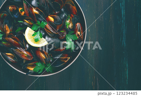 Fresh, Boiled mussels, Black Sea, with parsley and lemon, no people, top view Fresh, Boiled mussels, Black Sea, with parsley and lemon, no people, top view 123234485