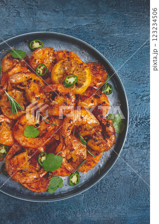 grilled shrimp, unpeeled, headless, with spices, on a dark blue table, homemade, no people, grilled shrimp, unpeeled, headless, with spices, on a dark blue table, homemade, no people, 123234506