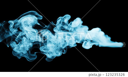 Blue smoke trails from a cigarette on black background. Blue smoke trails from a cigarette on black background. 123235326
