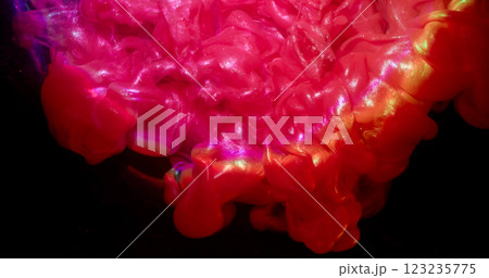 Glitter flow. Paint explosion. Glossy smoke pink orange red sparkling wave spill on black background. Art fluid powder abstract blur texture. Glitter flow. Paint explosion. Glossy smoke pink orange red sparkling wave spill on black background. Art fluid powder abstract blur texture. 123235775