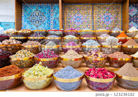 Traditional spices market. Pots and wooden tubs stand in row with colorful tea, spices, fruits, roots, flowers. Street bazaar. Dubai, UAE.  123236182