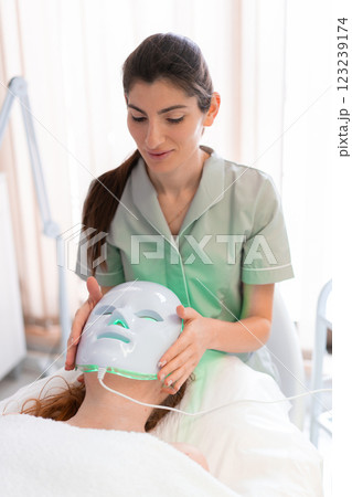 Female cosmetologist placing modern hydrafacial 123239174