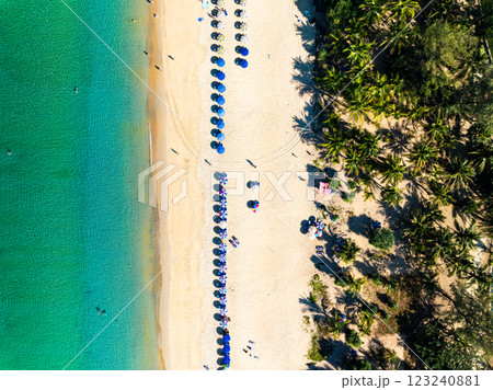 Summer seascape beautiful waves,Tropical sea water in sunny day, Top view from drone camera,Amazing ocean colorful nature background, Beautiful bright sea waves splashing on beach sand 123240881