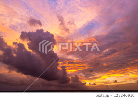 Amazing colorful clouds in sunset or sunrise sky over sea nature landscape background Amazing colorful clouds in sunset or sunrise sky over sea nature landscape background 123240910