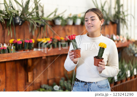 Woman chooses cacti Woman chooses cacti 123241290
