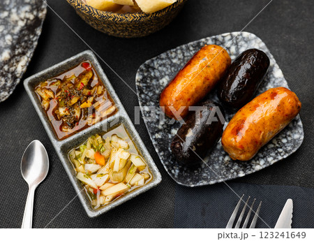 Grilled morcilla and chorizo sausages with vegetable salads Grilled morcilla and chorizo sausages with vegetable salads 123241649