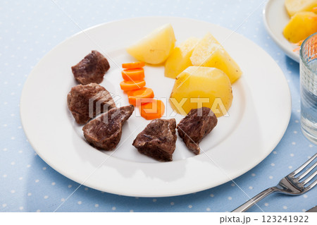 Steamed veal with potatoes and carrots. Diet food 123241922