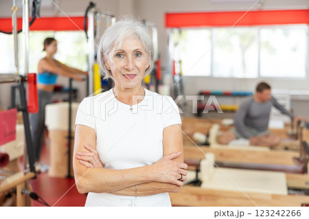 Elderly woman posing in pilates studio 123242266