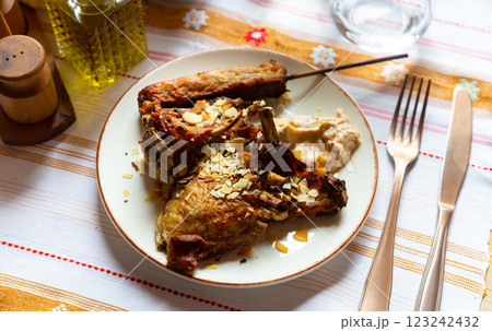 Baked lamb with kebab on wooden skewer and yogurt dip 123242432