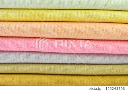 stack of colourful cotton clothes, close up pile of clothing 123243598