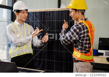 Construction team, blueprint and site building job for architect, builder and engineer sketching a construction project, green energy and solar panel concept Construction team, blueprint and site building job for architect, builder and engineer sketching a construction project, green energy and solar panel concept 123244522
