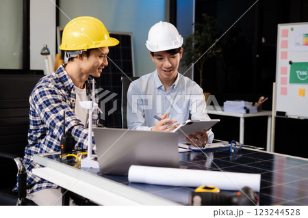 Construction team, blueprint and site building job for architect, builder and engineer sketching a construction project, green energy and solar panel concept Construction team, blueprint and site building job for architect, builder and engineer sketching a construction project, green energy and solar panel concept 123244528
