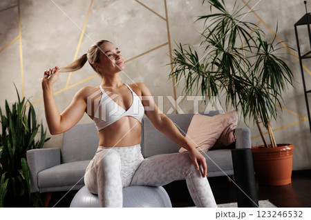 young girl doing home fitness, home workouts 123246532