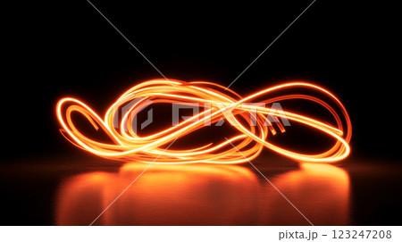 Abstract glowing light trails on a dark background create a dynamic and captivating visual effect with warm, inviting colors. 123247208