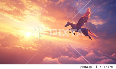 Majestic winged unicorn soaring through a vibrant sunset sky, symbolizing dreams and imagination come alive in a fantasy realm. 123247376