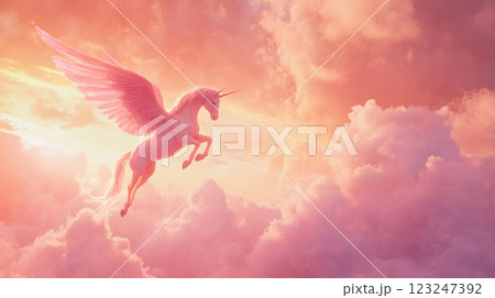 A majestic winged unicorn soars through a dreamy, cloud-filled sky, bathed in soft pink and gold light. Magical and ethereal beauty. 123247392