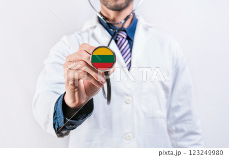 Lithuania healthcare system, doctor holding stethoscope. Lithuania health and medical insurance concept Lithuania healthcare system, doctor holding stethoscope. Lithuania health and medical insurance concept 123249980